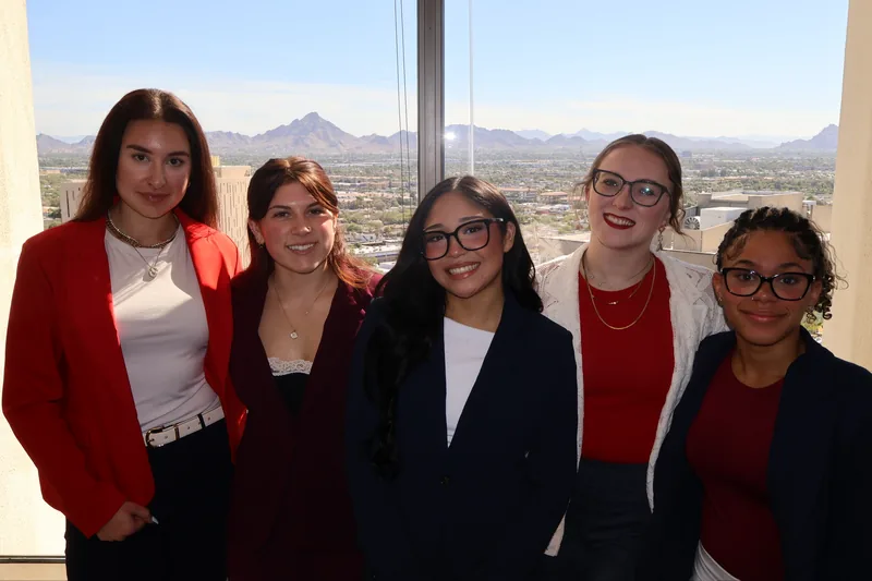RAD team members with Phoenix and the desert mountains behind them