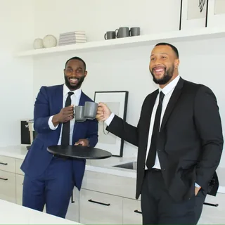 Two RAD team members with a coffee in the office kitchen